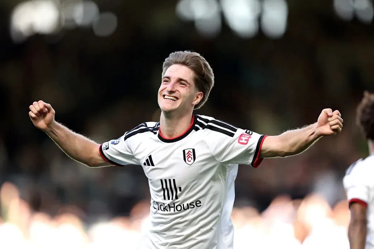 Fulham player celebrating a goal on the field Fulham player celebrating a goal on the field