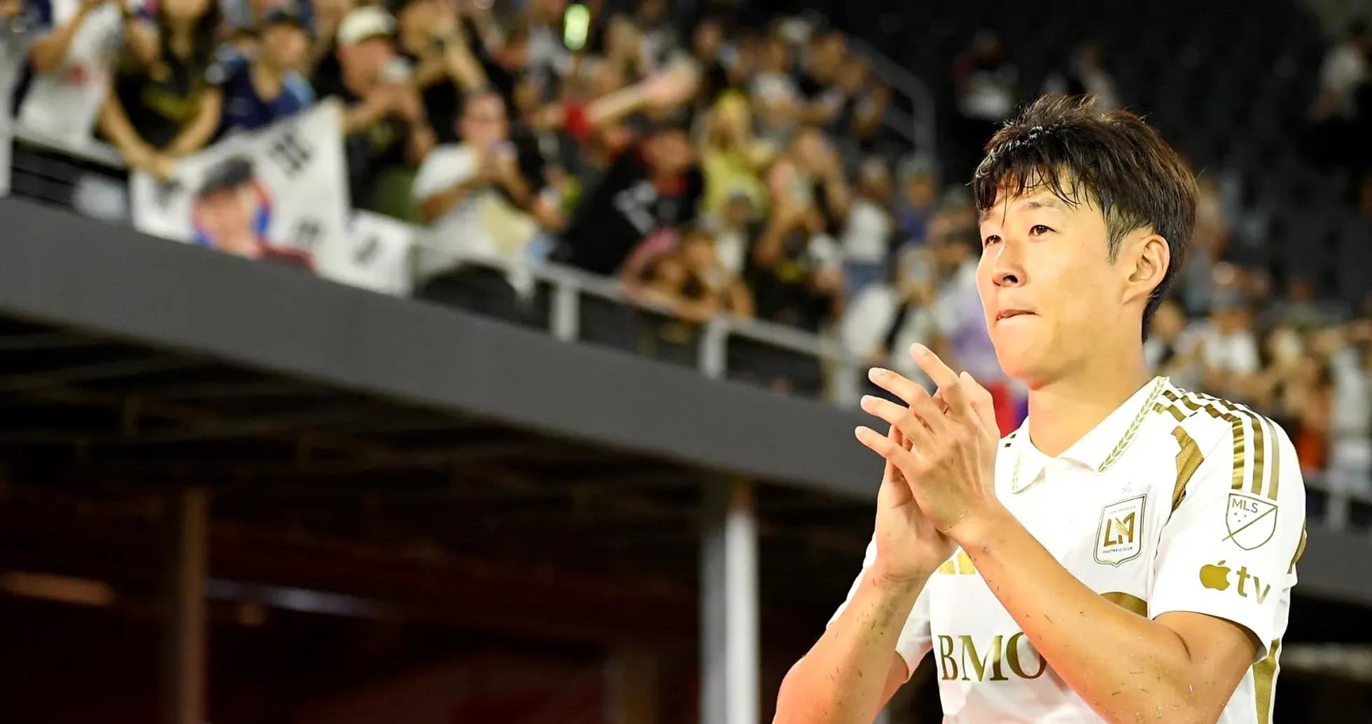 Player applauding fans after match in stadium Player applauding fans after match in stadium