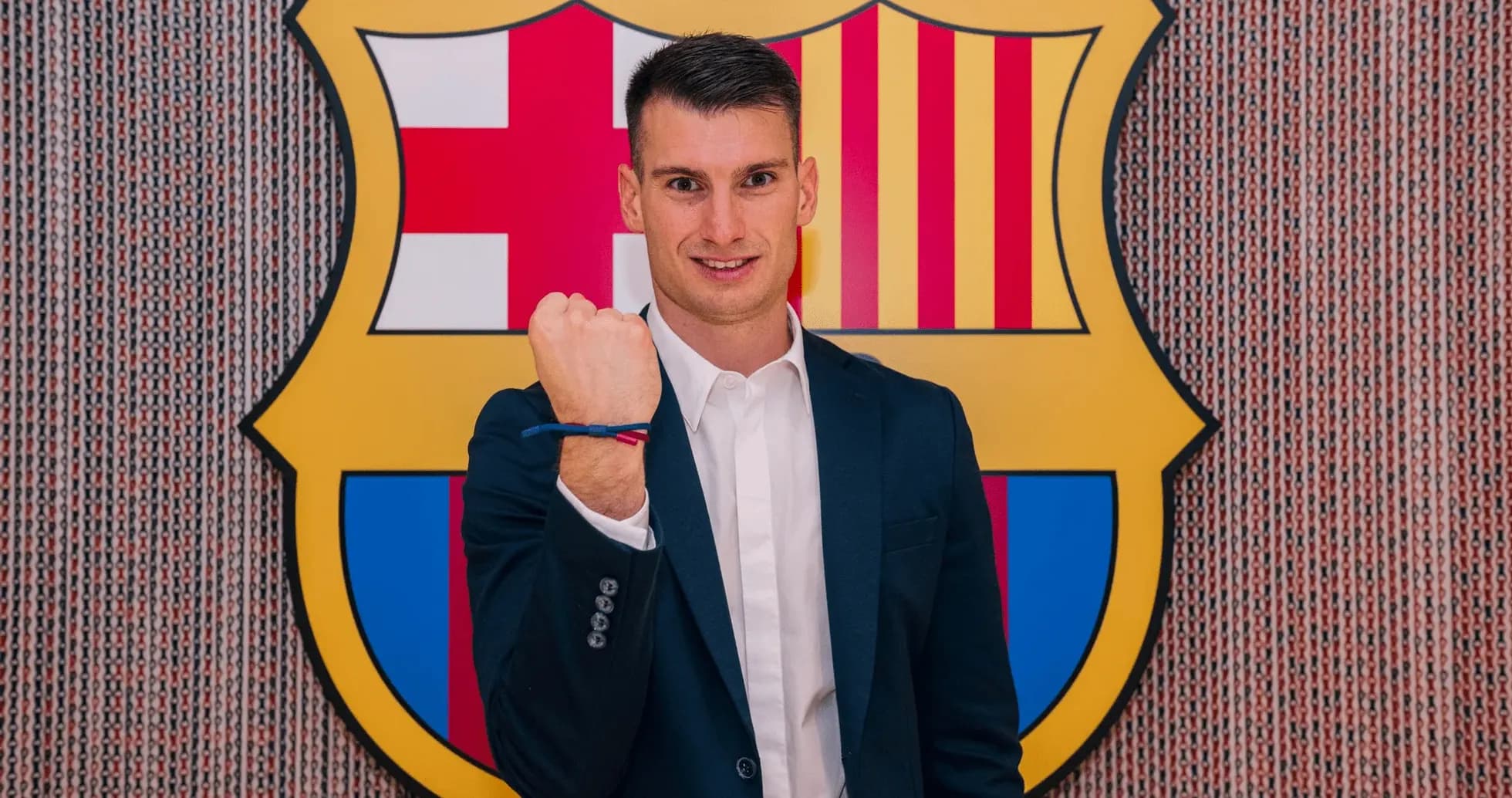 Player posing with Barcelona crest in background Player posing with Barcelona crest in background