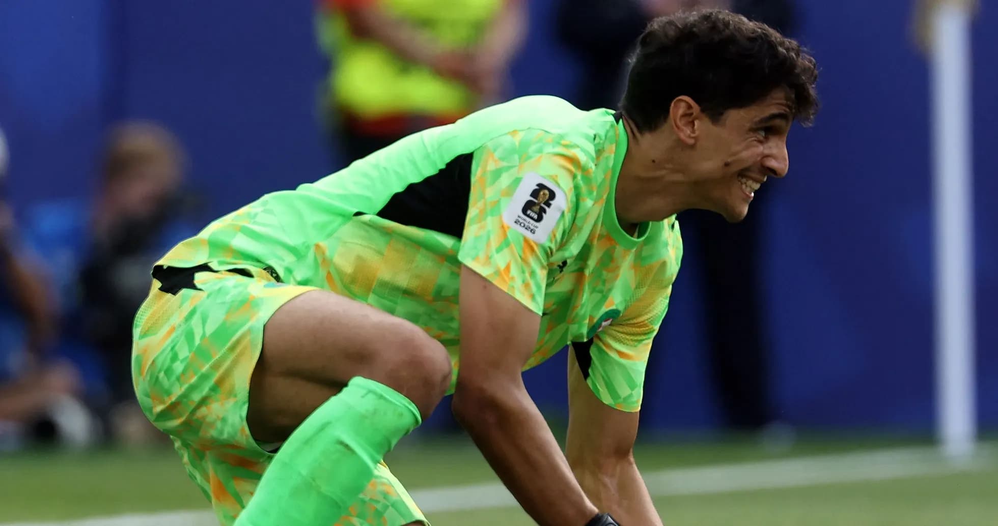 Goalkeeper in bright kit preparing for play Goalkeeper in bright kit preparing for play