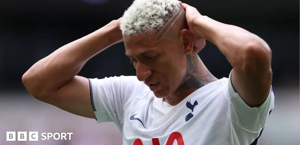 Player holding head in frustration during match Player holding head in frustration during match