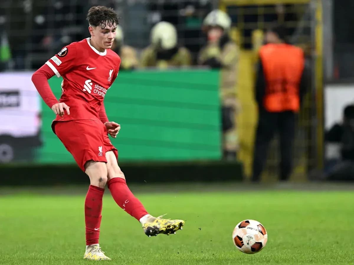 Player kicking ball during a football match Player kicking ball during a football match