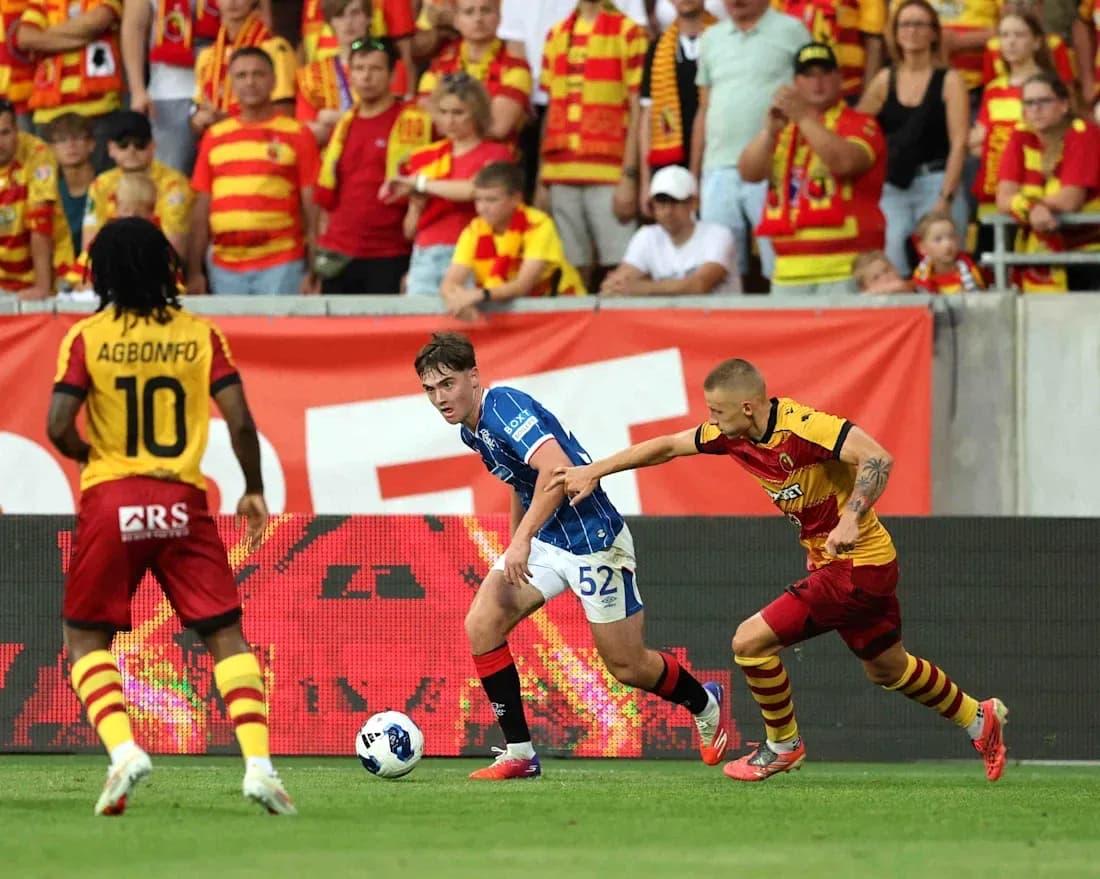 Jagiellonia players competing against Rangers Jagiellonia players competing against Rangers