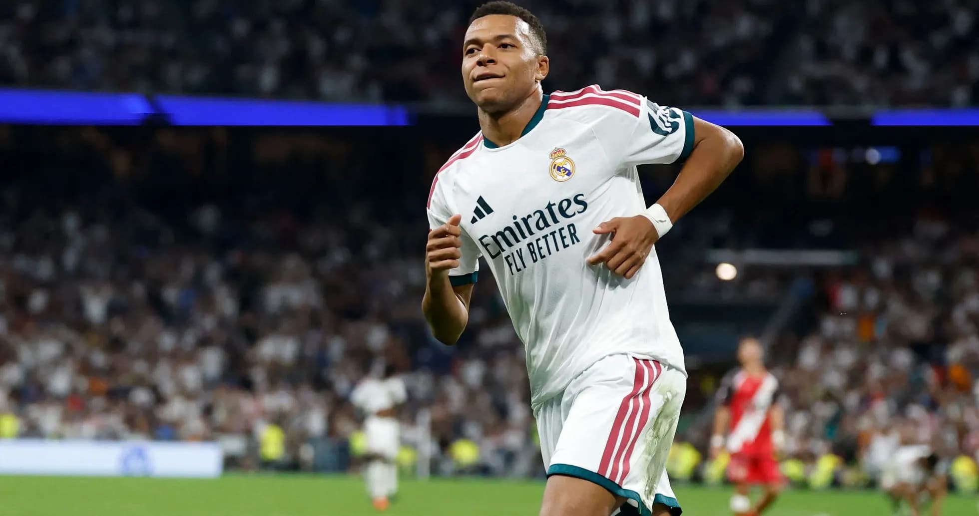 Player running during match in Real Madrid kit Player running during match in Real Madrid kit