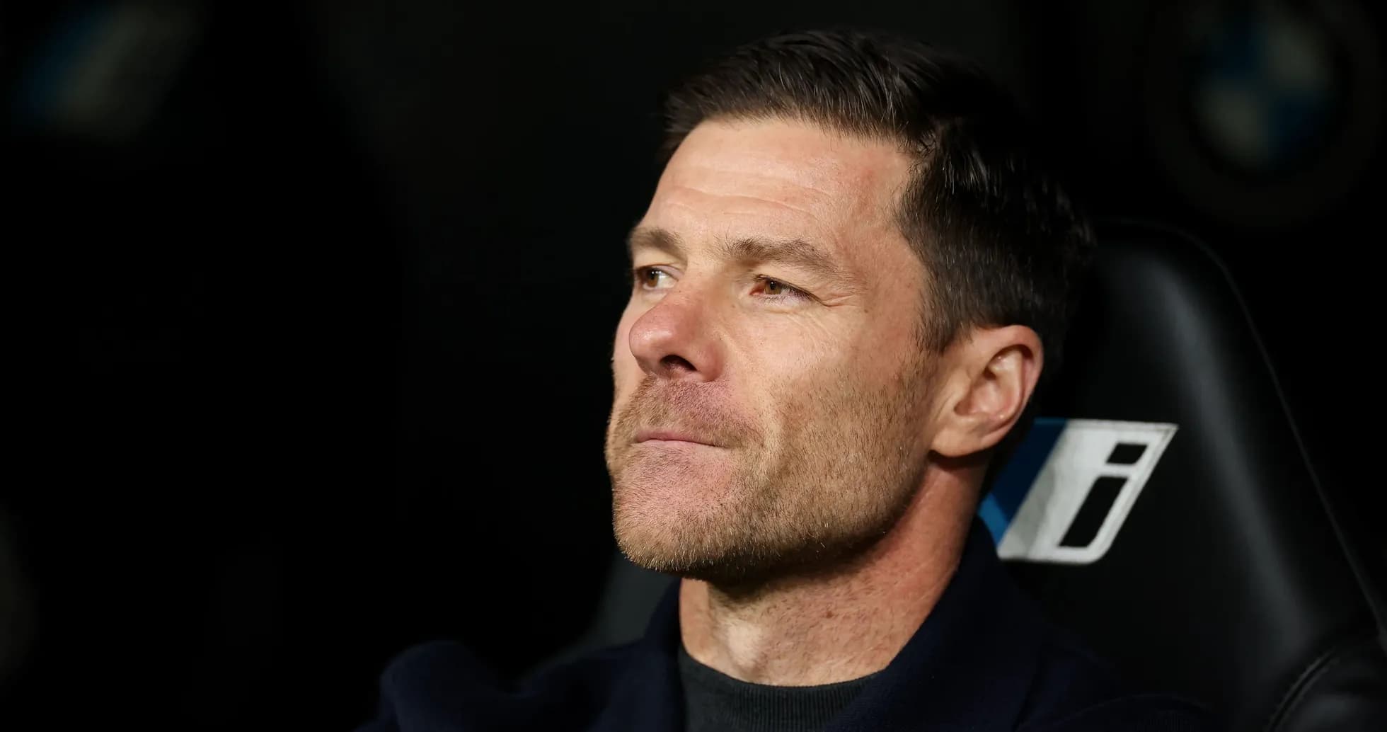 Coach sitting in dugout during match Coach sitting in dugout during match