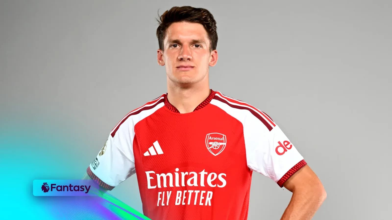 Player posing in Arsenal jersey against gray background Player posing in Arsenal jersey against gray background