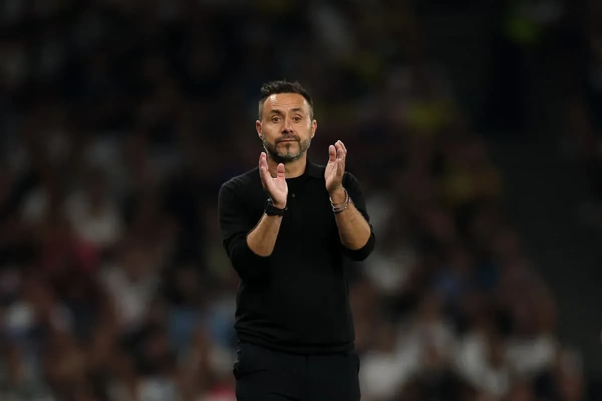 Coach applauding during a football match Coach applauding during a football match