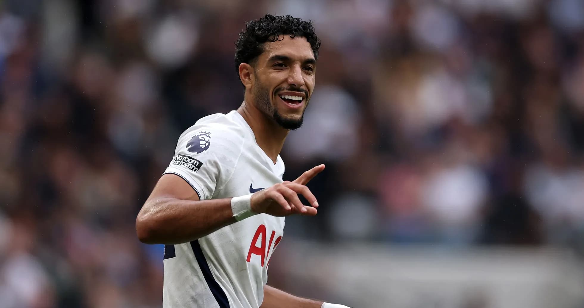 Player celebrating with fans during match Player celebrating with fans during match
