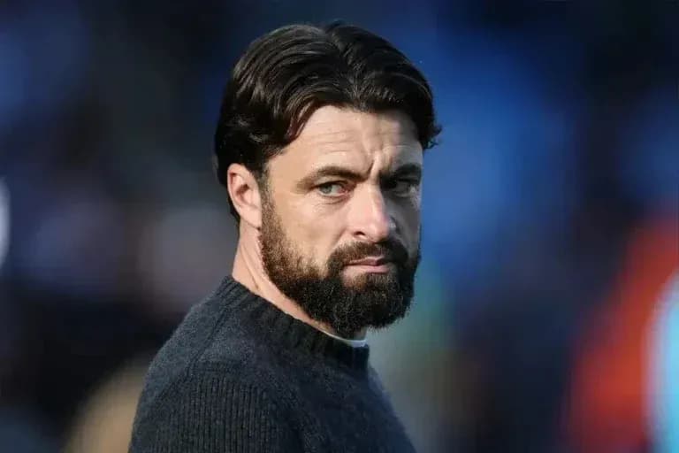 Man with beard looking intently off-camera Man with beard looking intently off-camera