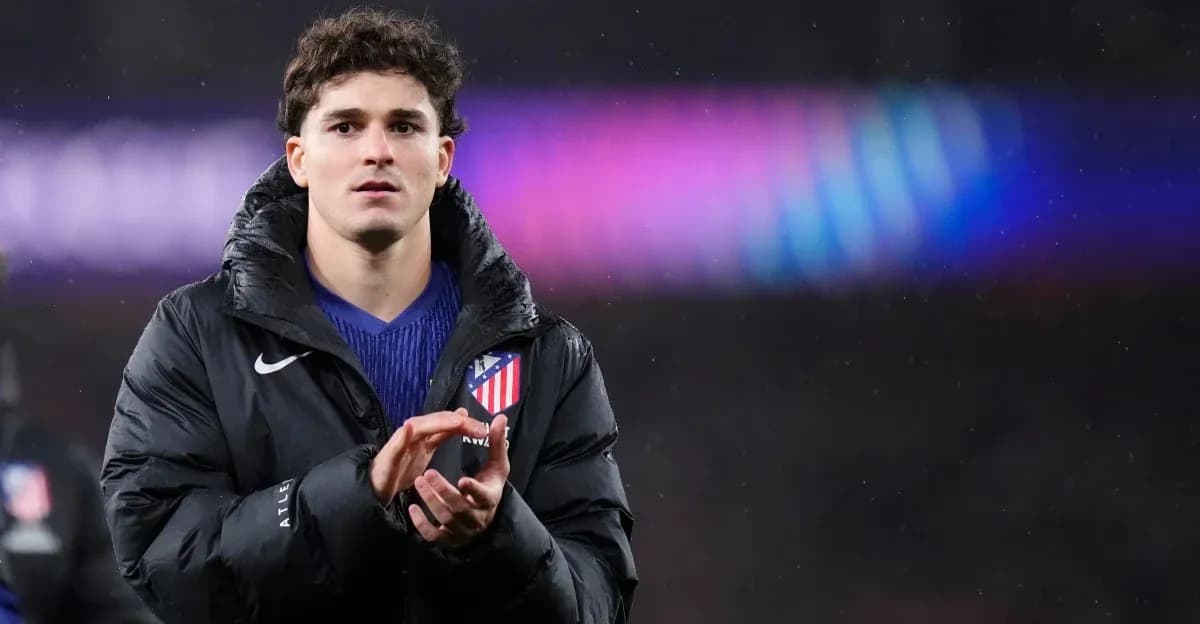 Player applauding while wearing an Atletico Madrid jacket Player applauding while wearing an Atletico Madrid jacket