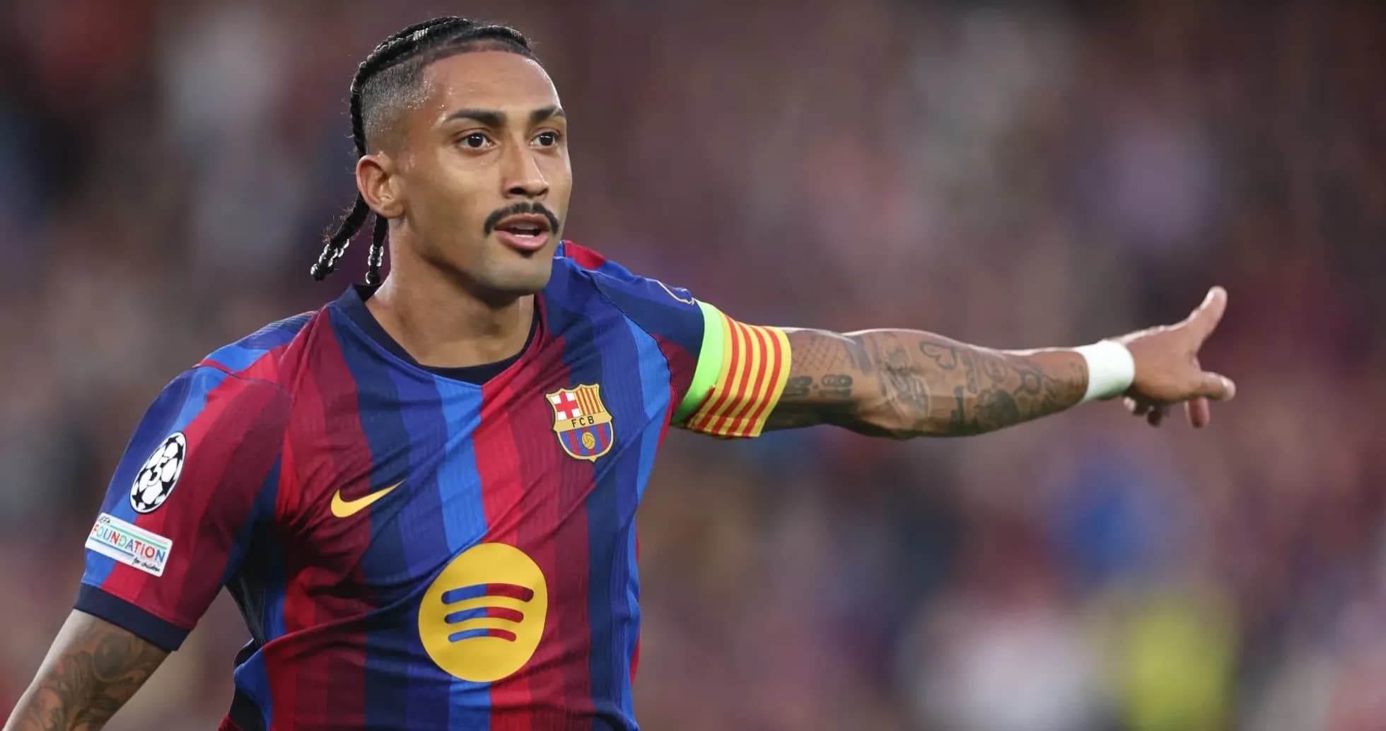 Player signaling during a match for FC Barcelona Player signaling during a match for FC Barcelona