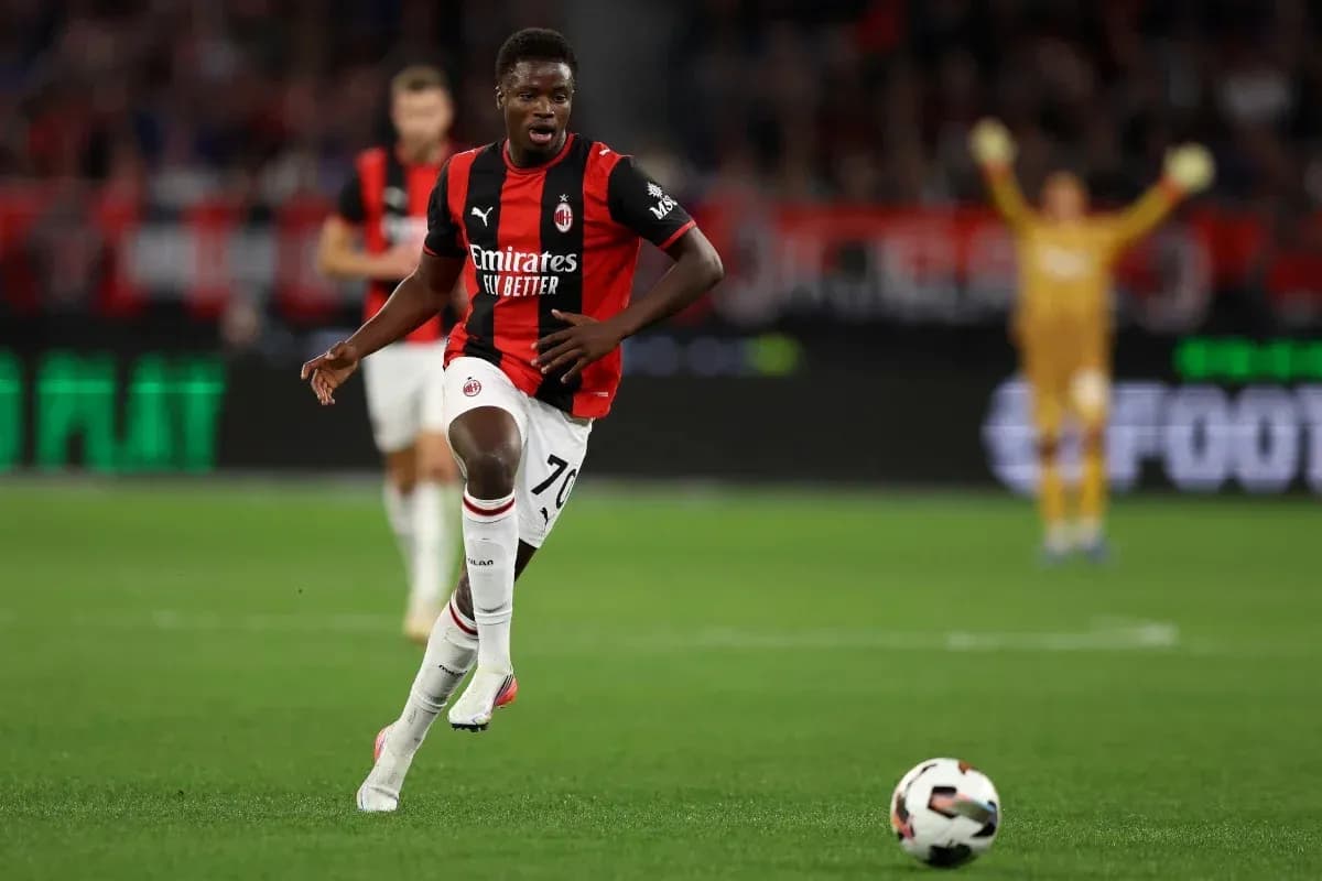 Player running with ball during AC Milan match Player running with ball during AC Milan match