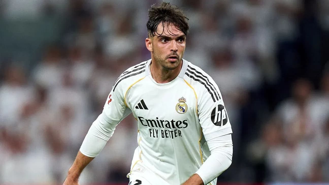 Player in Real Madrid jersey during match action Player in Real Madrid jersey during match action