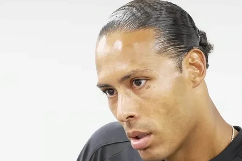 Player engaged in interview, focused expression Player engaged in interview, focused expression