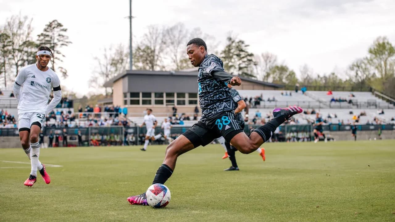 Player kicking ball during Huntsville City match Player kicking ball during Huntsville City match