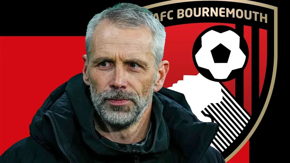 Coach in front of AFC Bournemouth logo background Coach in front of AFC Bournemouth logo background