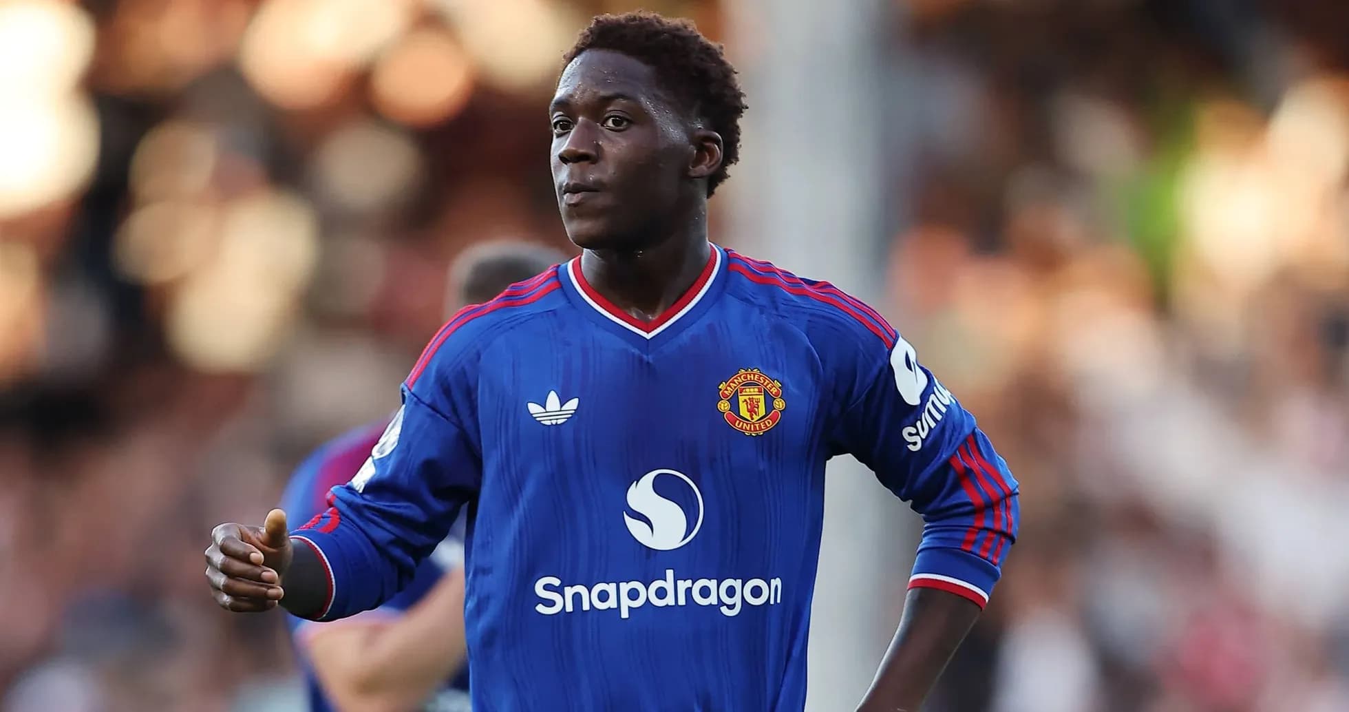 Player in blue Manchester United kit during match Player in blue Manchester United kit during match