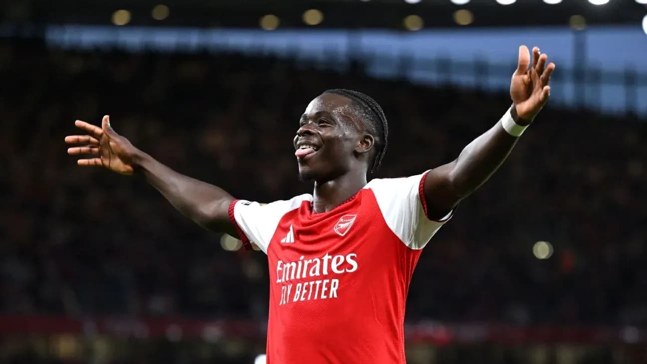 Player celebrating a goal for Arsenal at stadium Player celebrating a goal for Arsenal at stadium