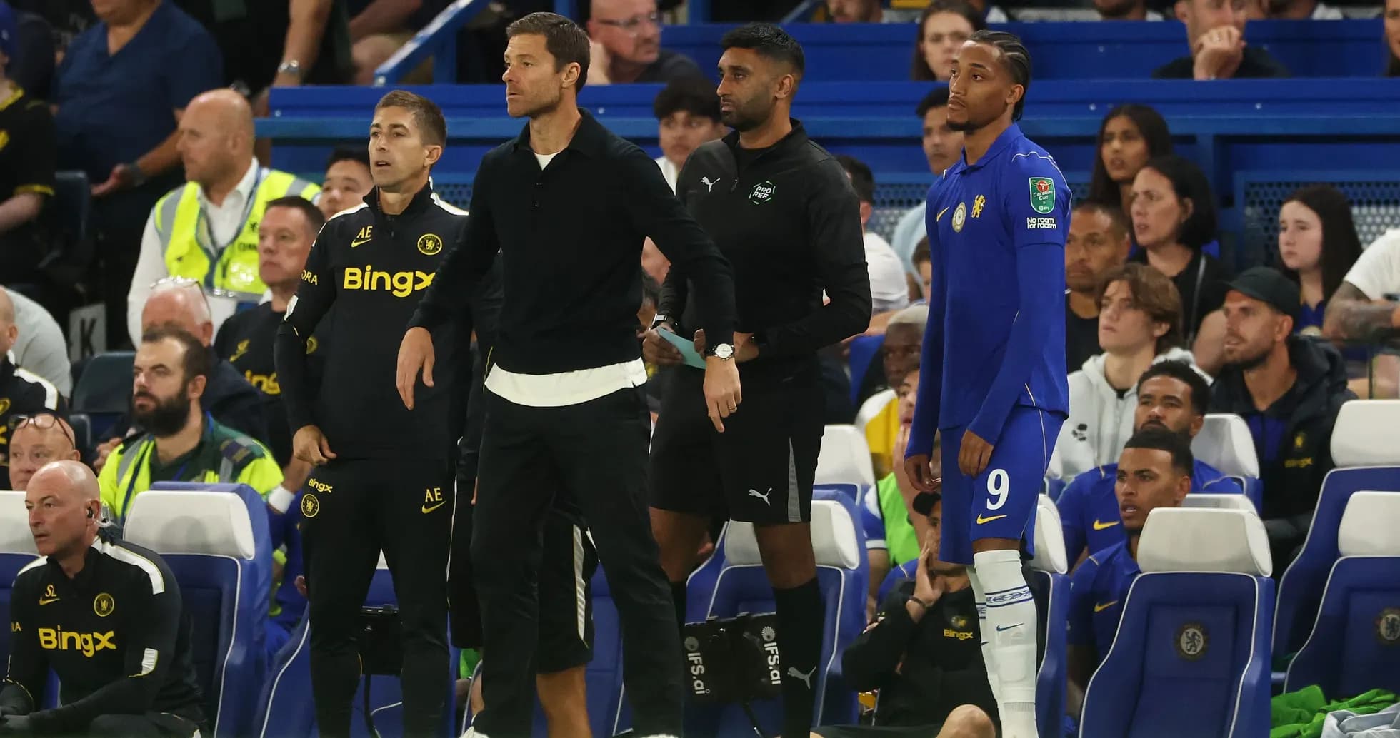 Coaching staff and player on bench during match Coaching staff and player on bench during match