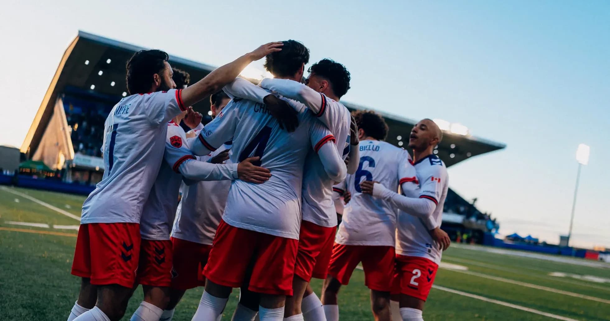 Players celebrating a goal during match Players celebrating a goal during match