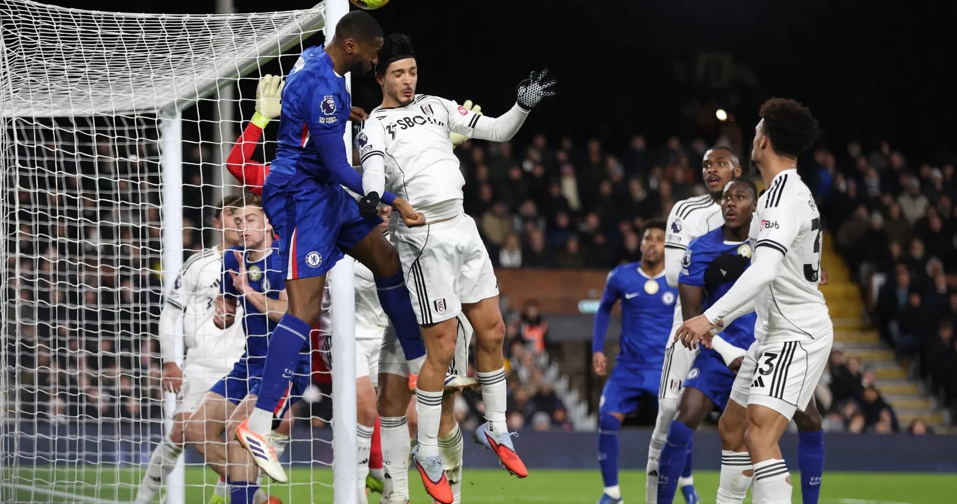 Chelsea player challenging for a header against Fulham Chelsea player challenging for a header against Fulham