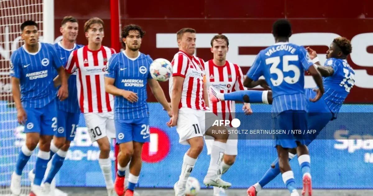 Players from Brighton and Brentford during match action Players from Brighton and Brentford during match action