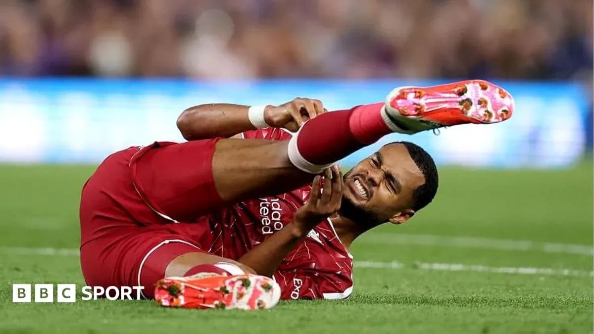 Player in red jersey injured on the field Player in red jersey injured on the field