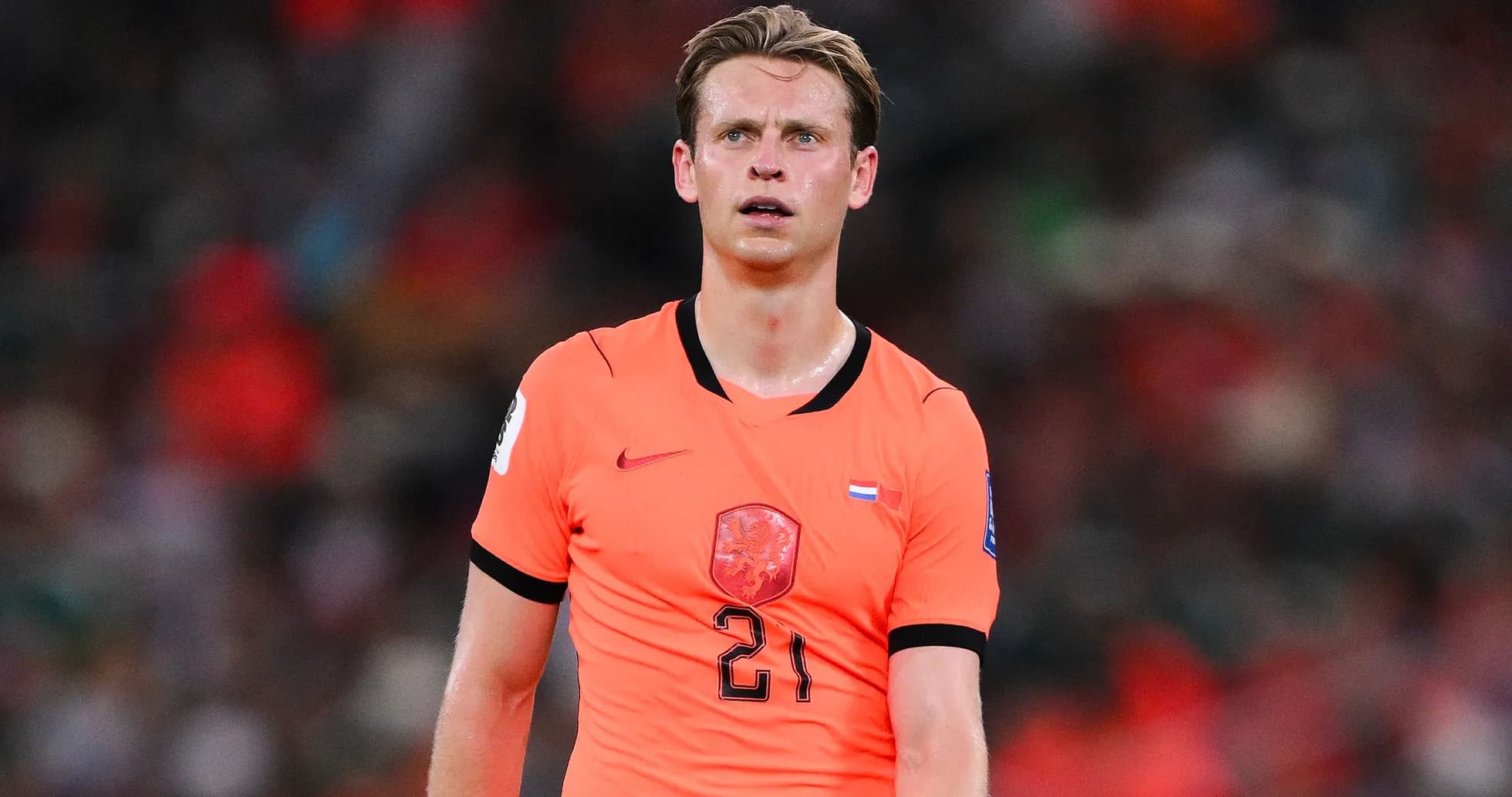 Player wearing orange jersey during a match Player wearing orange jersey during a match