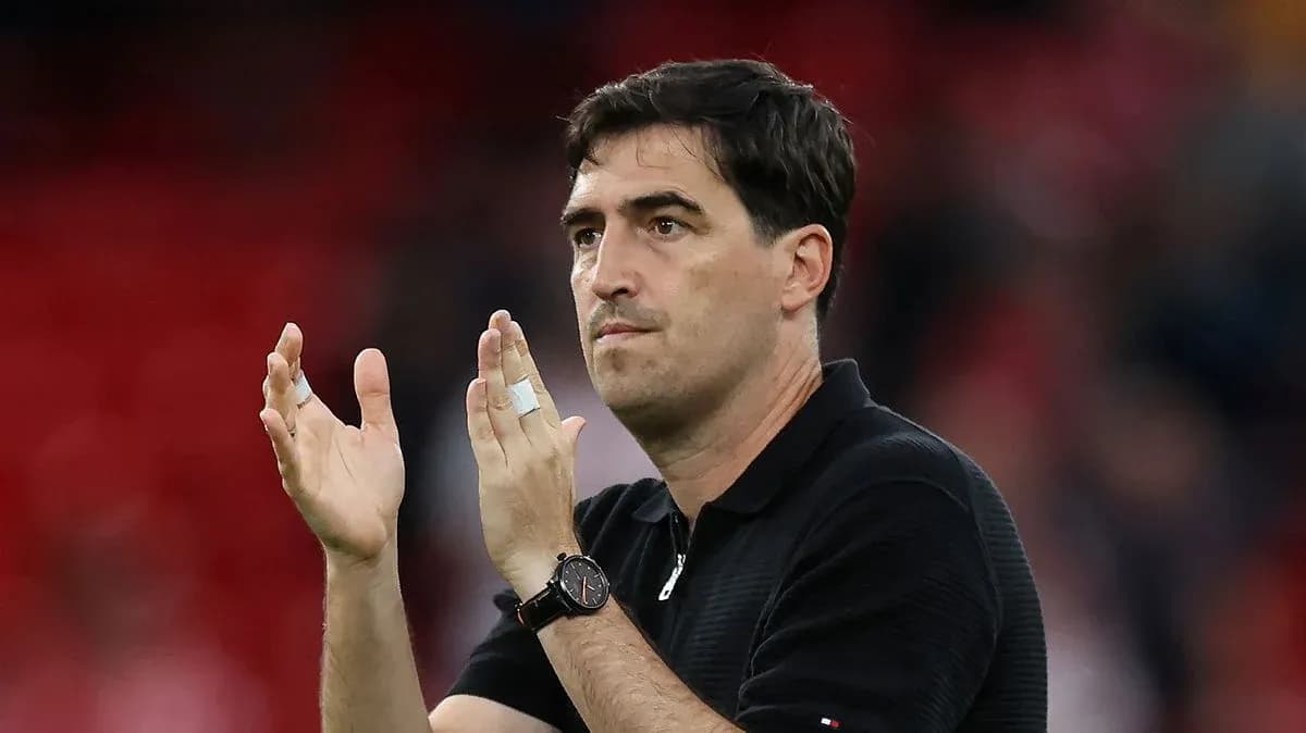 Coach applauding fans after the match Coach applauding fans after the match