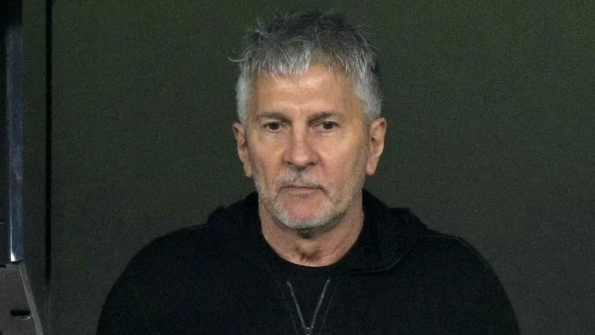 Man with gray hair in dark hoodie Man with gray hair in dark hoodie