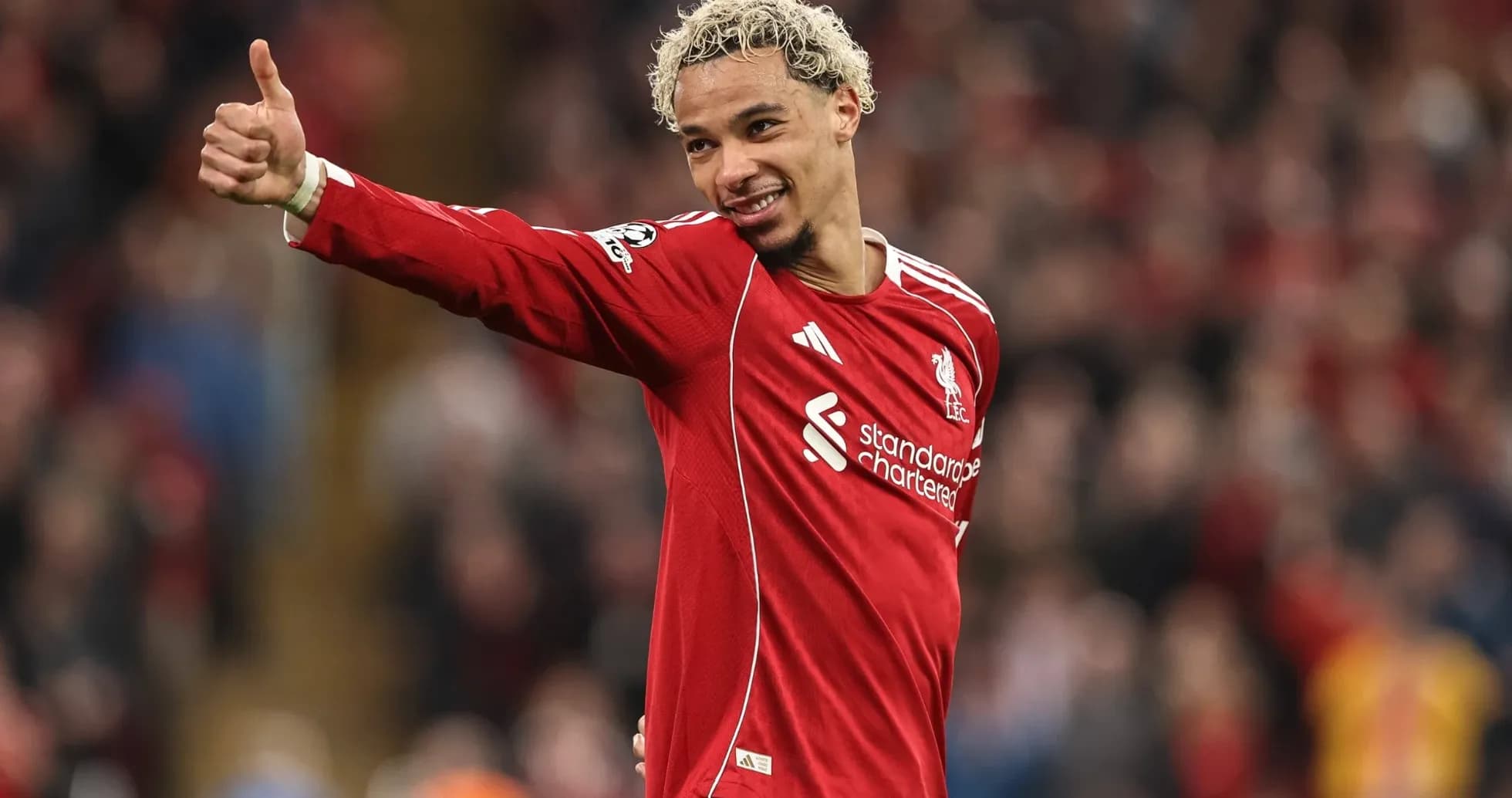 Player giving thumbs up in Liverpool jersey Player giving thumbs up in Liverpool jersey