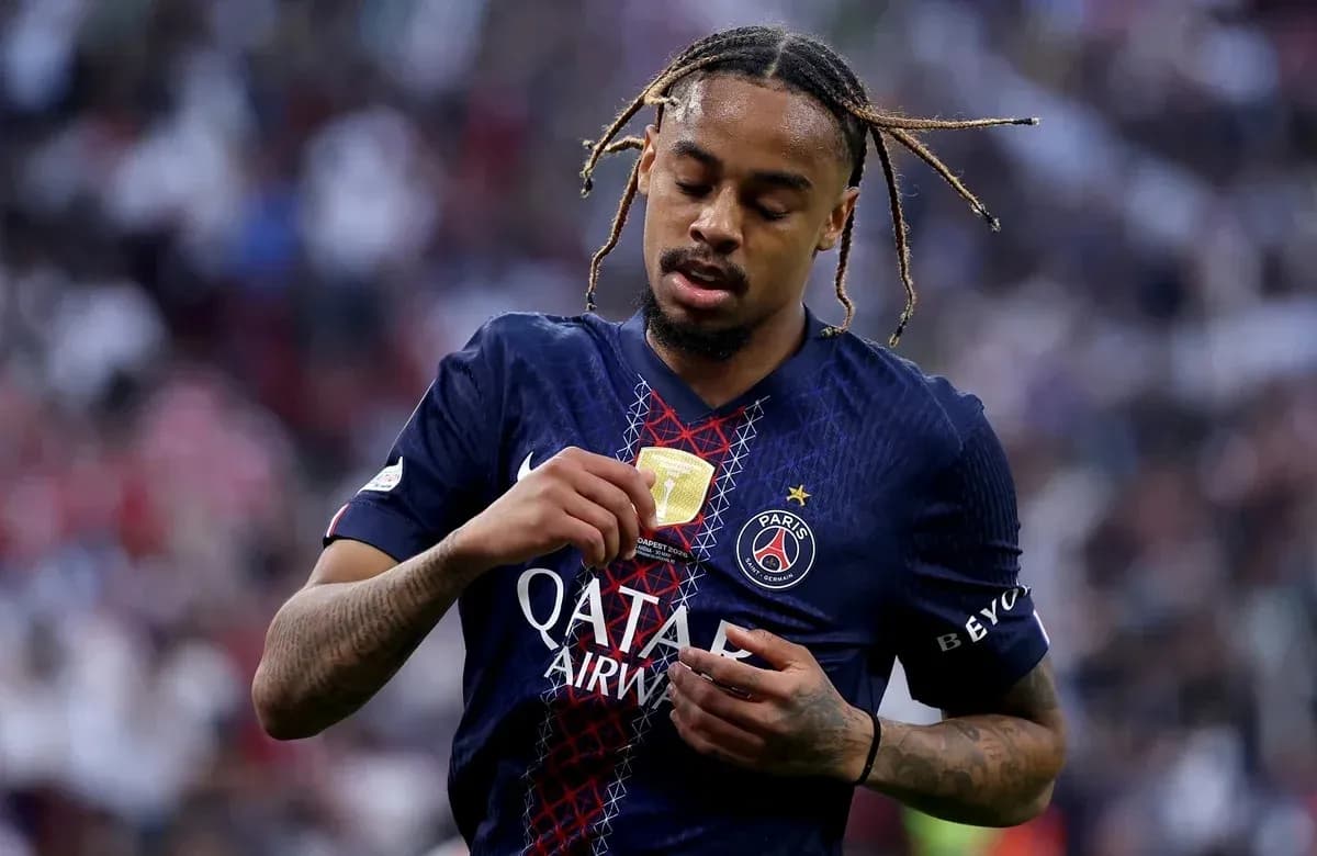 Player examining medal on Paris Saint-Germain jersey Player examining medal on Paris Saint-Germain jersey