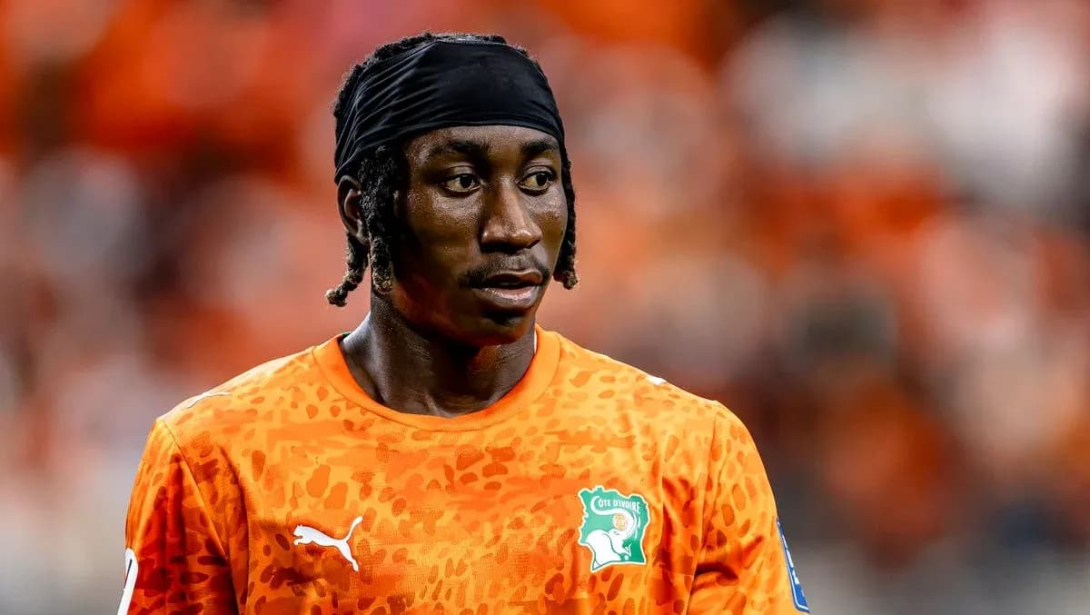 Player wearing orange jersey during a match Player wearing orange jersey during a match