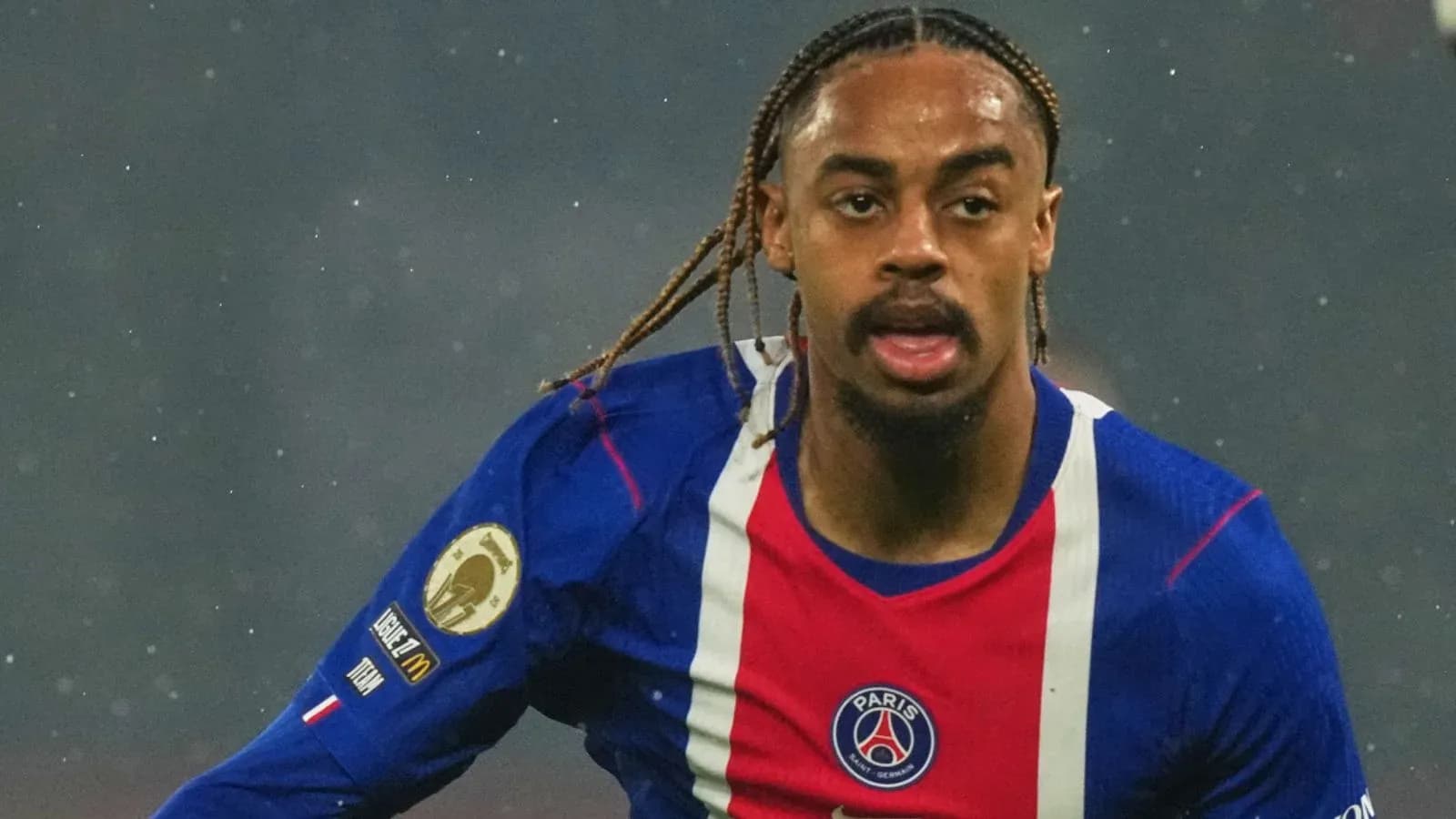 Player running during a match in PSG jersey Player running during a match in PSG jersey