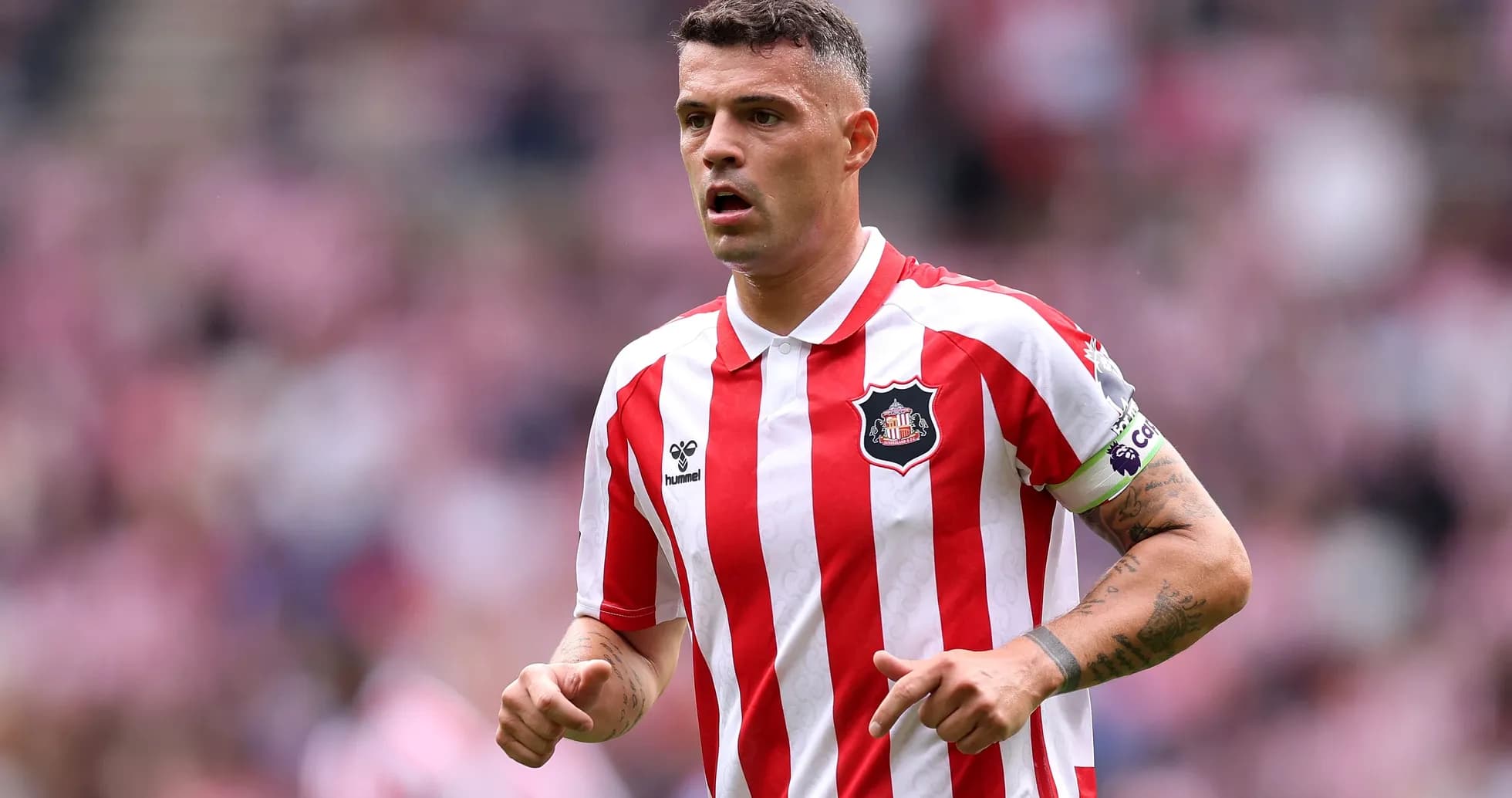 Sunderland player in red and white striped jersey Sunderland player in red and white striped jersey