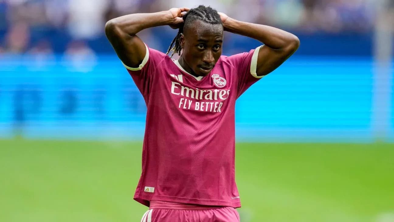 Player in pink jersey with hands on head Player in pink jersey with hands on head