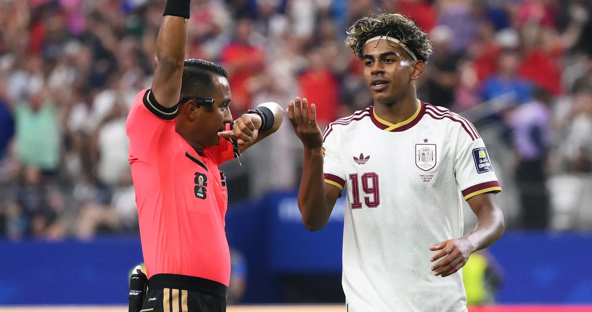 Referee showing a card to player during match Referee showing a card to player during match