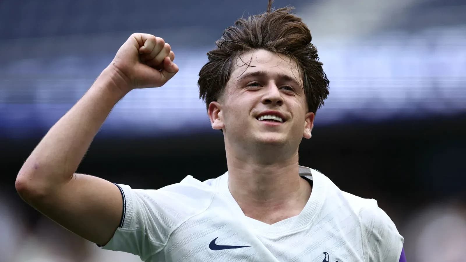 Player celebrating victory with raised fist Player celebrating victory with raised fist