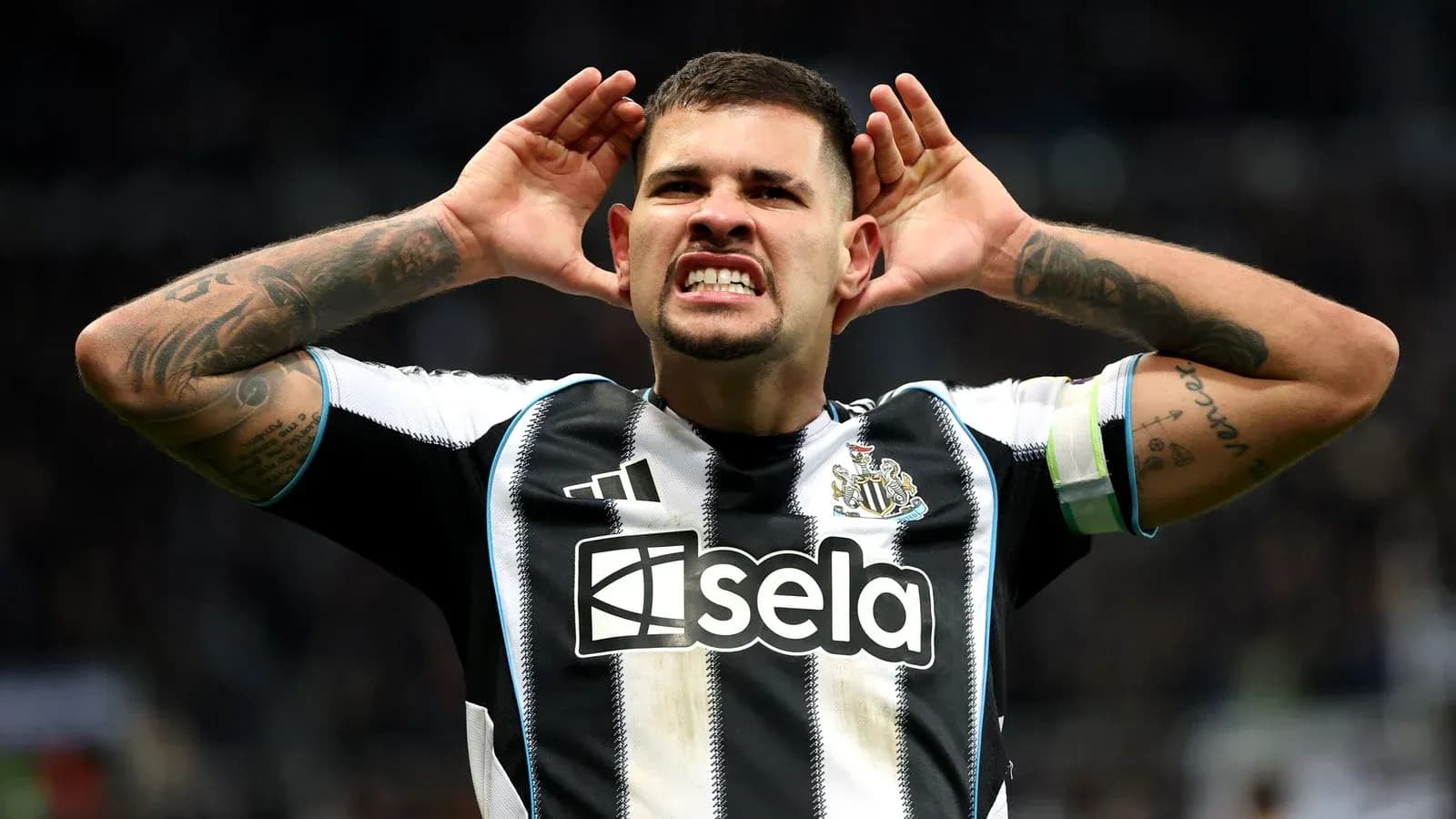 Player celebrating goal with hands to ears Player celebrating goal with hands to ears
