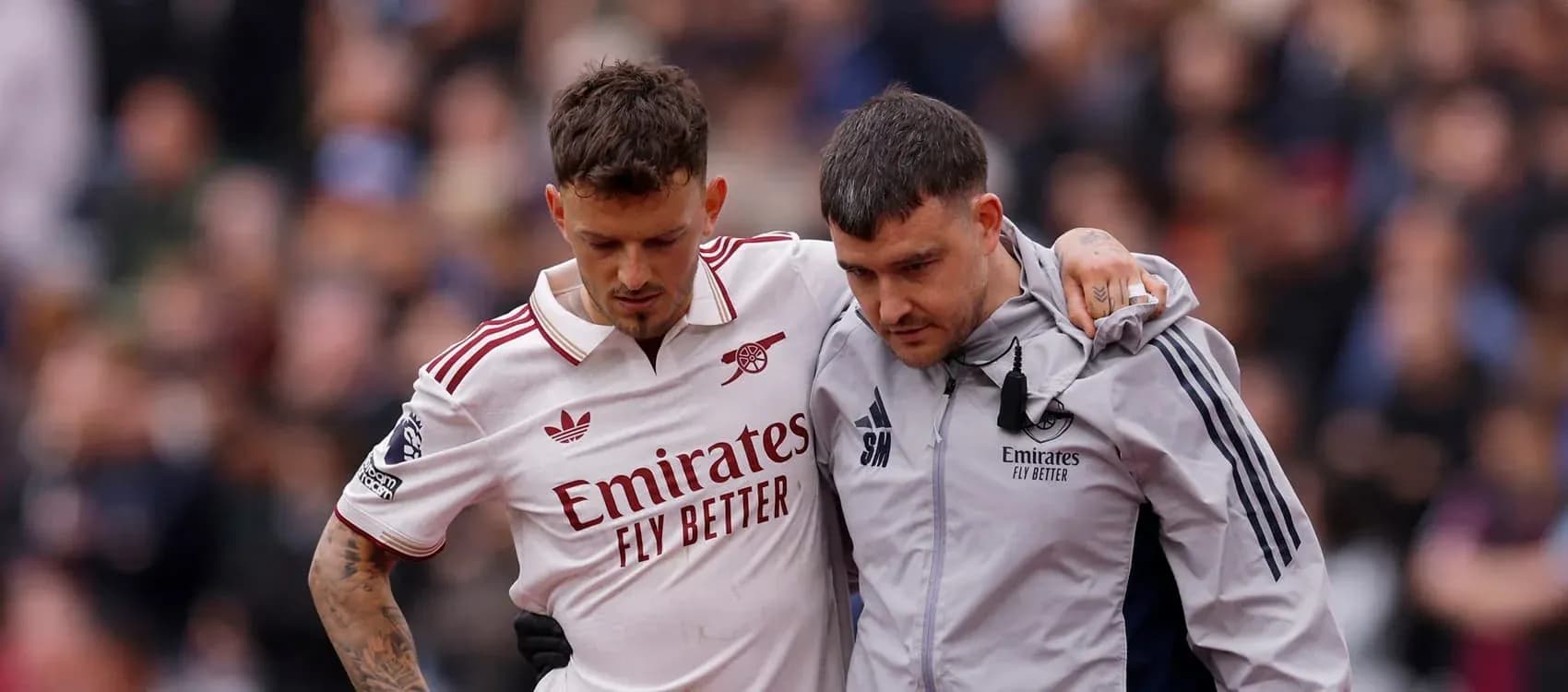 Player being assisted off the field by staff Player being assisted off the field by staff