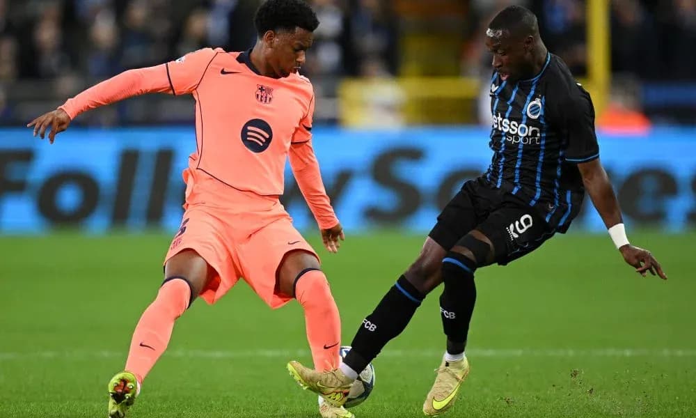 Two players contesting the ball during a match Two players contesting the ball during a match