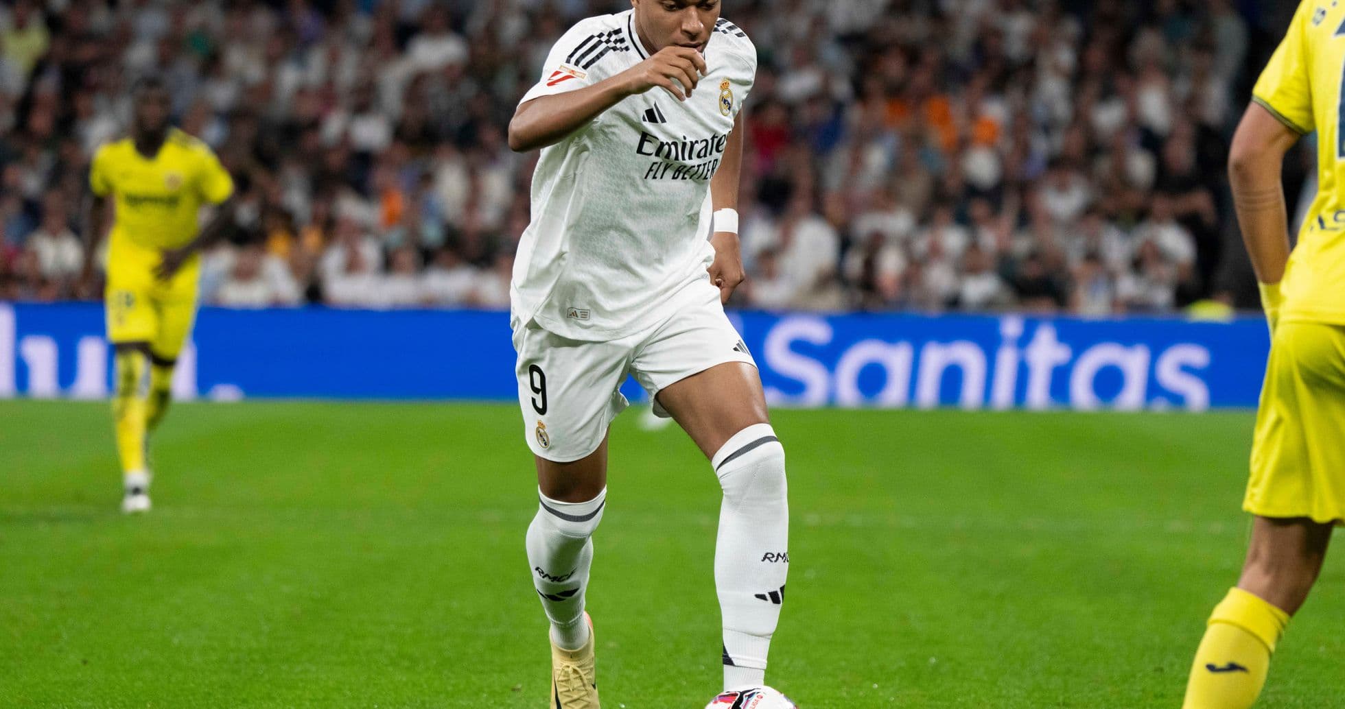 Player dribbling the ball during a match Player dribbling the ball during a match