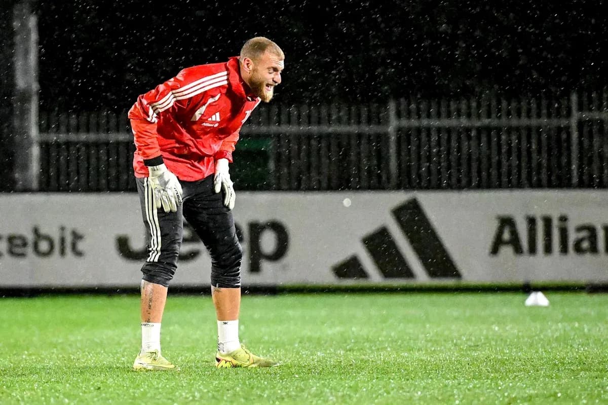Goalkeeper training in rain at practice session Goalkeeper training in rain at practice session