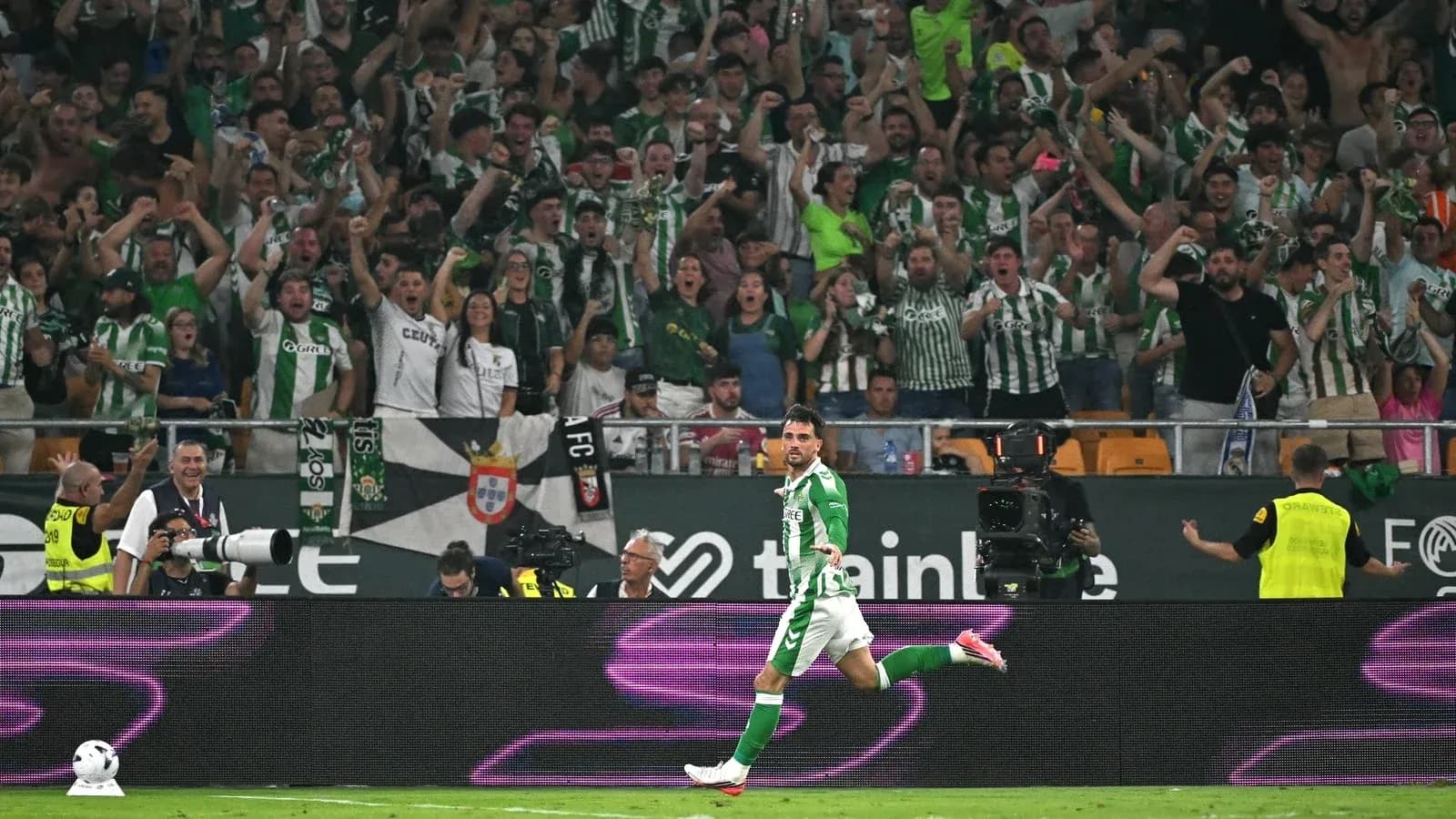 Player celebrating in front of cheering crowd Player celebrating in front of cheering crowd