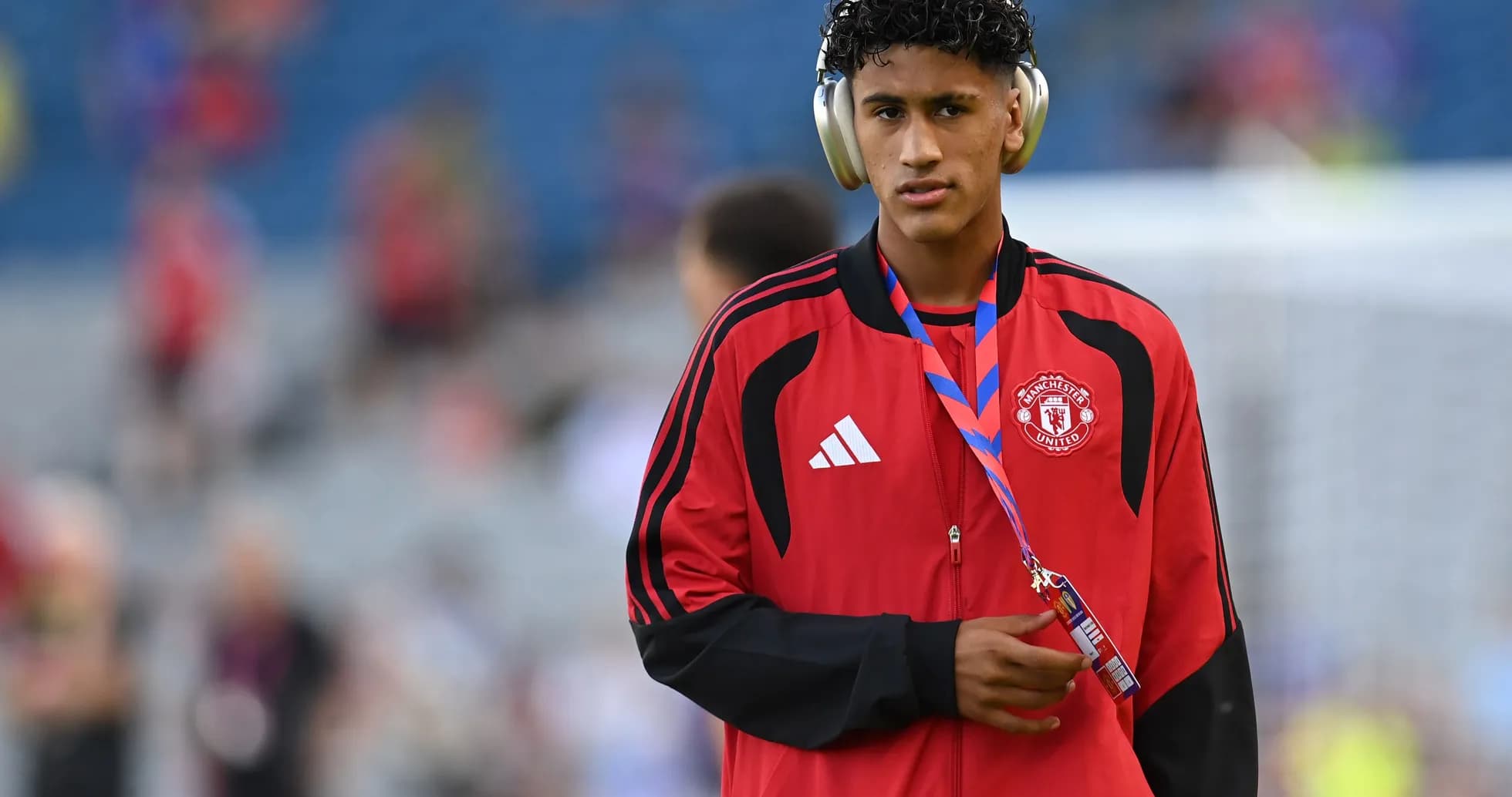 Player wearing headphones and Manchester United tracksuit Player wearing headphones and Manchester United tracksuit