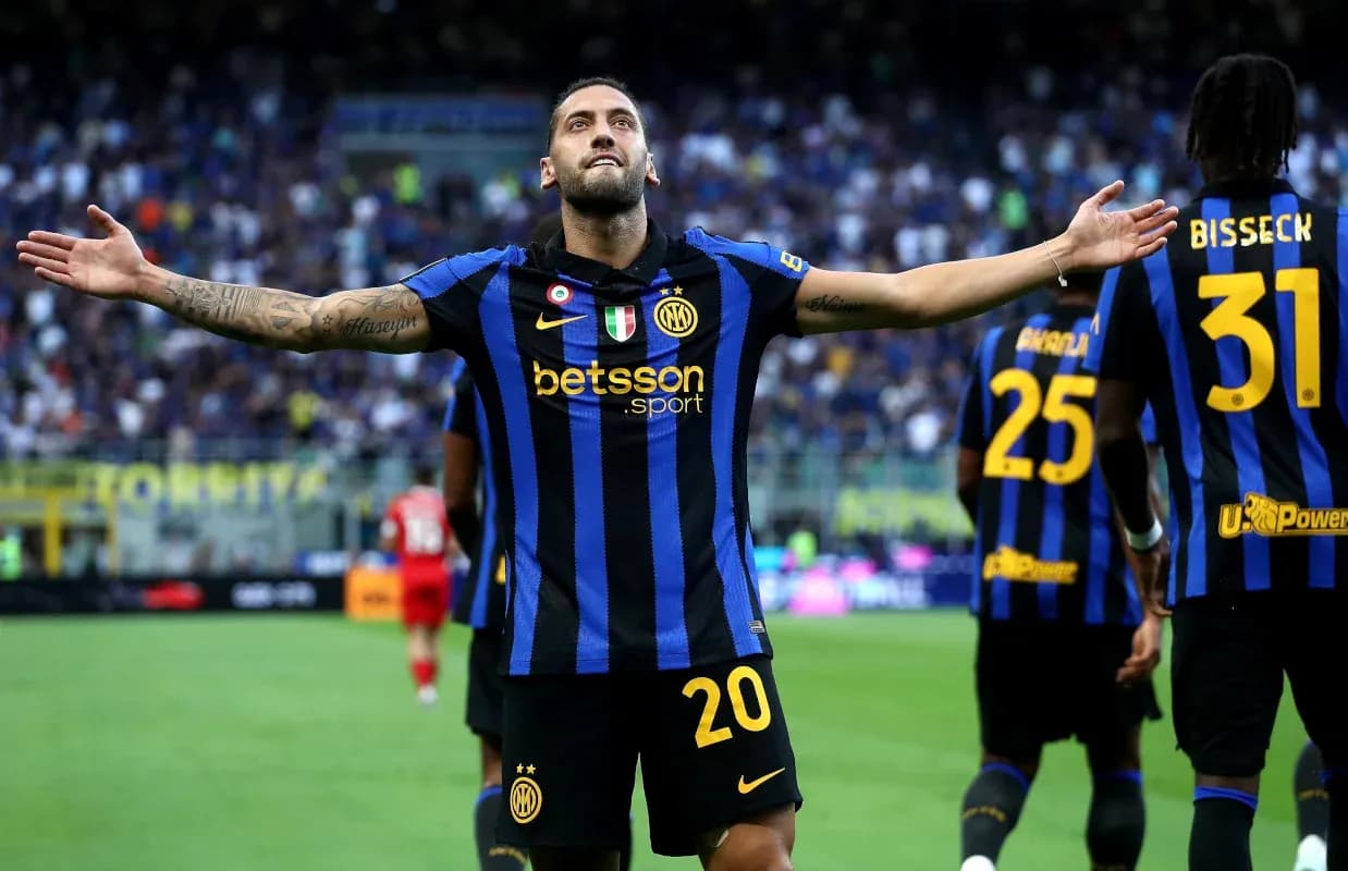 Player celebrating goal with teammates in stadium Player celebrating goal with teammates in stadium