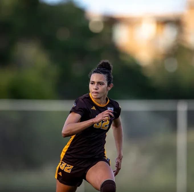 Player in brown uniform running on the field Player in brown uniform running on the field
