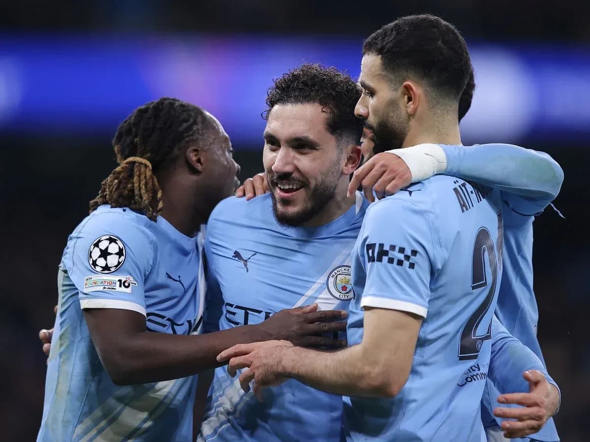 Manchester City players celebrating a goal Manchester City players celebrating a goal