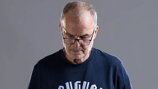 Man wearing glasses looking down thoughtfully Man wearing glasses looking down thoughtfully