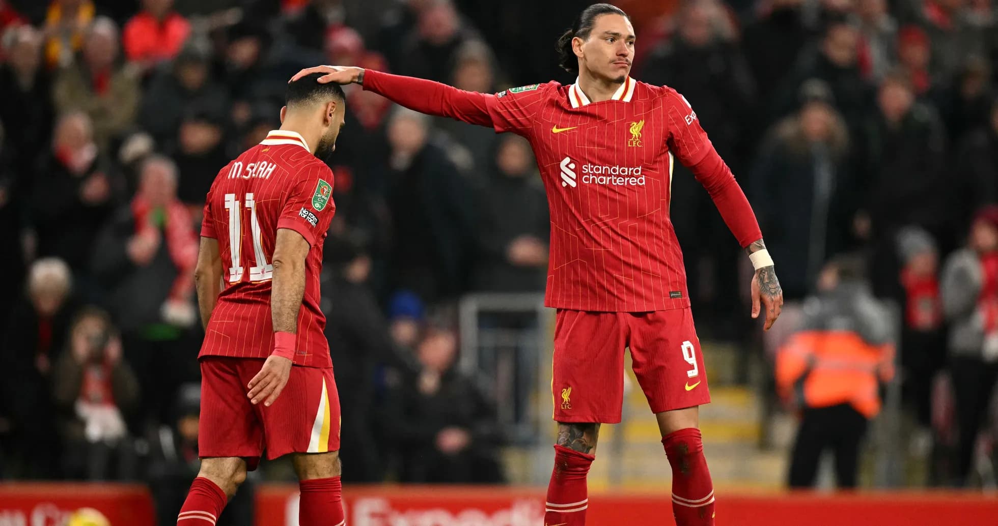 Two Liverpool players on the pitch during match Two Liverpool players on the pitch during match